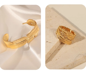 Detailed macro view of gold-plated feather open ring and matching cuff bracelet set