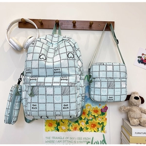 Three-piece school bag set with blue checkerboard pattern including backpack and pouches