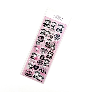 Close-up of pink and black laser stickers featuring cute cartoon characters and hearts