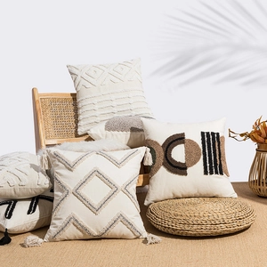 Set of bohemian tufted cotton linen cushion covers with geometric embroidery and tassels
