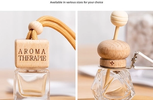 Detail of square glass perfume bottle with wooden cap and diamond cut car vent clip