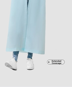 Detail of light blue waterproof EVA raincoat showing extra-long hem and snap buttons