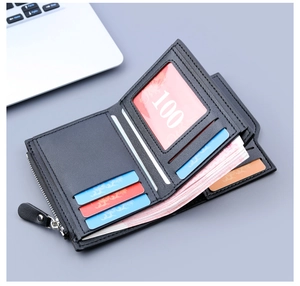 Internal view of a black leather men's trifold wallet with multiple card slots and zipper pocket
