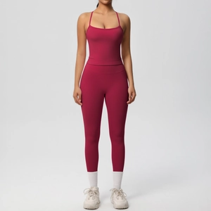 Front view of a burgundy high-waisted yoga set with thin straps and leggings