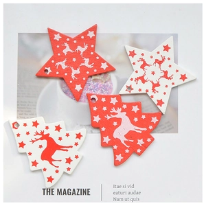 Close-up of red and white wooden Christmas ornaments in star and tree shapes