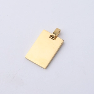 Macro detail of polished gold rectangular pendant with reflective mirror surface finish