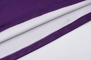 Detailed close-up of double-needle stitching and fine knit texture on a purple summer dress
