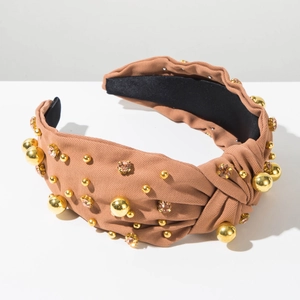 Detail of light brown top knot headband with gold beads and sparkling champagne rhinestones
