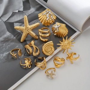 Golden titanium steel ocean jewelry set with starfish rings and seashell brooches