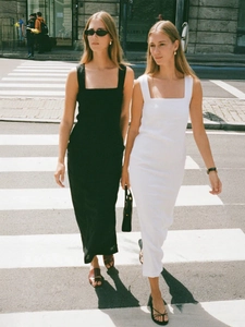 Detail of square neck sleeveless maxi dresses in black and white with slim fit cotton fabric
