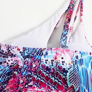 Close-up of multicolored snake print bikini with adjustable straps and metal buckles
