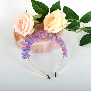 Handmade golden wire headband with raw blue and purple crystals on pink quartz