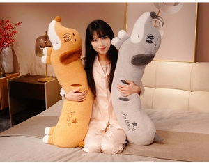 Detail of soft dachshund plush pillow with HAPPY embroidery and cute cartoon facial features
