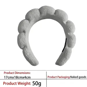 Macro view of light grey cloud sponge headband detailing dimensions 17x18x4cm and material
