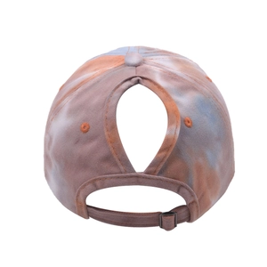 Detail of adjustable metal buckle and ponytail hole on tie-dye baseball cap