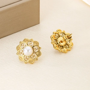 Exquisite gold floral pearl stud earrings in stainless steel with hollow petal design