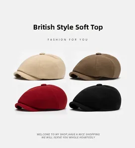 Detail view of four wool blend newsboy caps in beige, brown, red and black colors