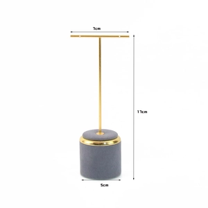 Minimalist T-bar jewelry display stand with golden metal frame and gray velvet base