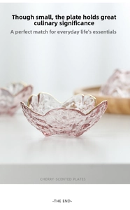 Detail of pink cherry blossom glass sauce dish with gold rim and hammered texture