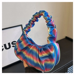Detail of colorful ruched rainbow shoulder bag with vibrant gradient pleats and handle
