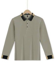 Detailed view of long-sleeve waffle polo shirt featuring contrast color knit collar and cuffs