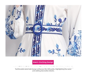 Detail of high waist cut with blue botanical print and navy belt on white maxi dress