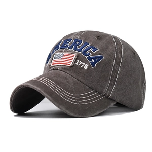 Detail of vintage gray cotton baseball cap with American flag patch and embroidery