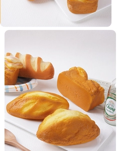 Realistic PU slow rebound puff bread models arranged on a ceramic plate for home decor