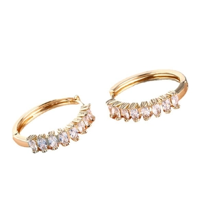 Elegant gold-plated hoop earrings featuring marquise-cut cubic zirconia in a minimal style