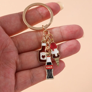 Creative keychain featuring enamel wine bottle, ice cream, and cola pendants on a gold ring