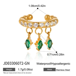 Detailed view of gold stainless steel ear cuff with green marquise zircon pendants