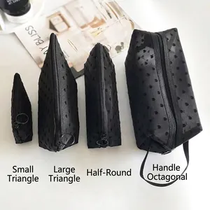 Set of four black mesh heart makeup bags with ring zippers and diverse functional shapes