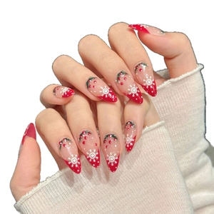 Christmas press-on nails with red and white snow patterns in almond shape for women