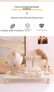 Detailed view of luxury pink PU leather jewelry display set for necklaces and rings