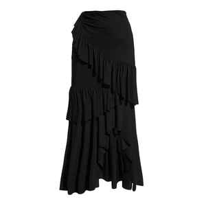Detail of elegant black multi-layered asymmetric ruffled maxi skirt with flowing drapes