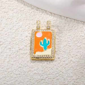 Macro view of a gold tarot pendant featuring cactus enamel inlay and zircon borders