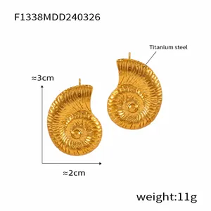Detailed view showing the 3cm height and 2cm width of gold titanium shell earrings