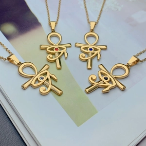 Detailed view of Ankh cross necklaces with Horus eye pendants in four gemstone colors