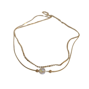 Double-layer gold mermaid pearl necklace with sleek snake chain and textured bar link