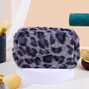 Large capacity gray-purple leopard print plush makeup bag on white pedestal display