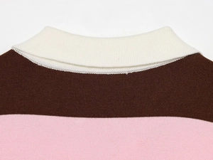 Close-up of white collar and tricolor striped knit texture on a polo shirt