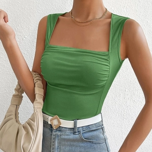 Detailed texture of grass green ribbed knit tank top with a square neck and elastic fabric