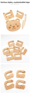 Detail of Montessori wooden kitchen tools set with animal shaped safety knives for kids