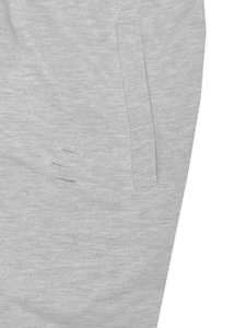 Detail shot of men's casual shorts showing side pocket and parallel distressed elements