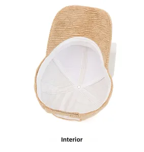 Detailed view of corduroy baseball cap interior with quilted lining and reinforced stitching