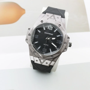 Macro shot of large black carbon fiber dial with sub-dials on a rugged quartz watch