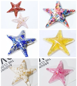 Macro detail of starfish resin crafts with diverse crystal stones and shell fillings