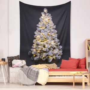 Christmas cedar tree tapestry hung above bed creating cozy winter holiday atmosphere
