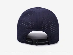 Detail of dark blue baseball cap back showing laser-cut diamond ventilation holes