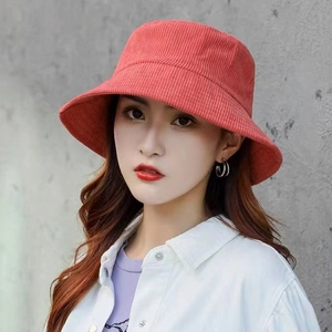 Retro red corduroy bucket hat for women featuring an adjustable minimalist design